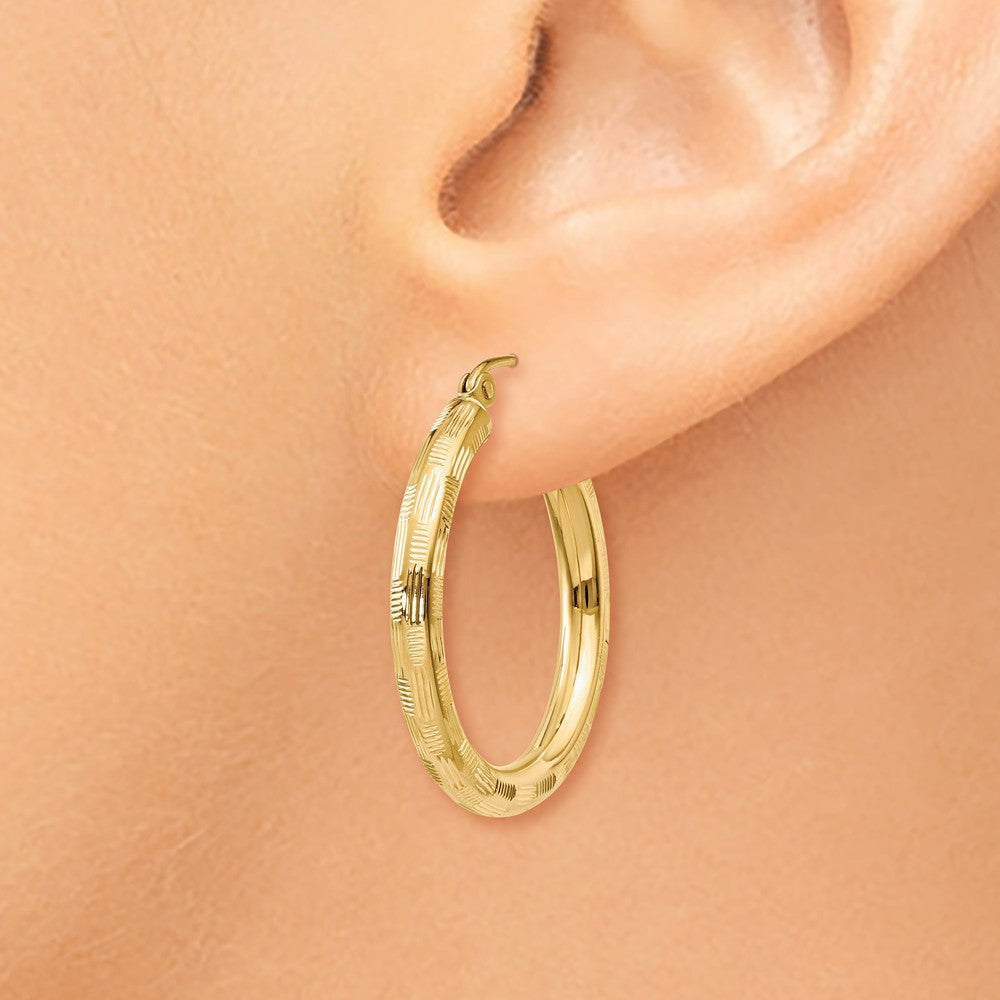 Alternate view of the 3mm x 25mm 14k Yellow Gold Textured Round Hoop Earrings by The Black Bow Jewelry Co.