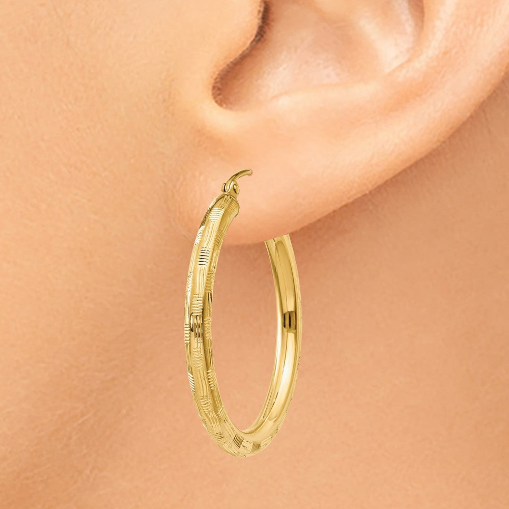 Alternate view of the 3mm x 30mm 14k Yellow Gold Textured Round Hoop Earrings by The Black Bow Jewelry Co.