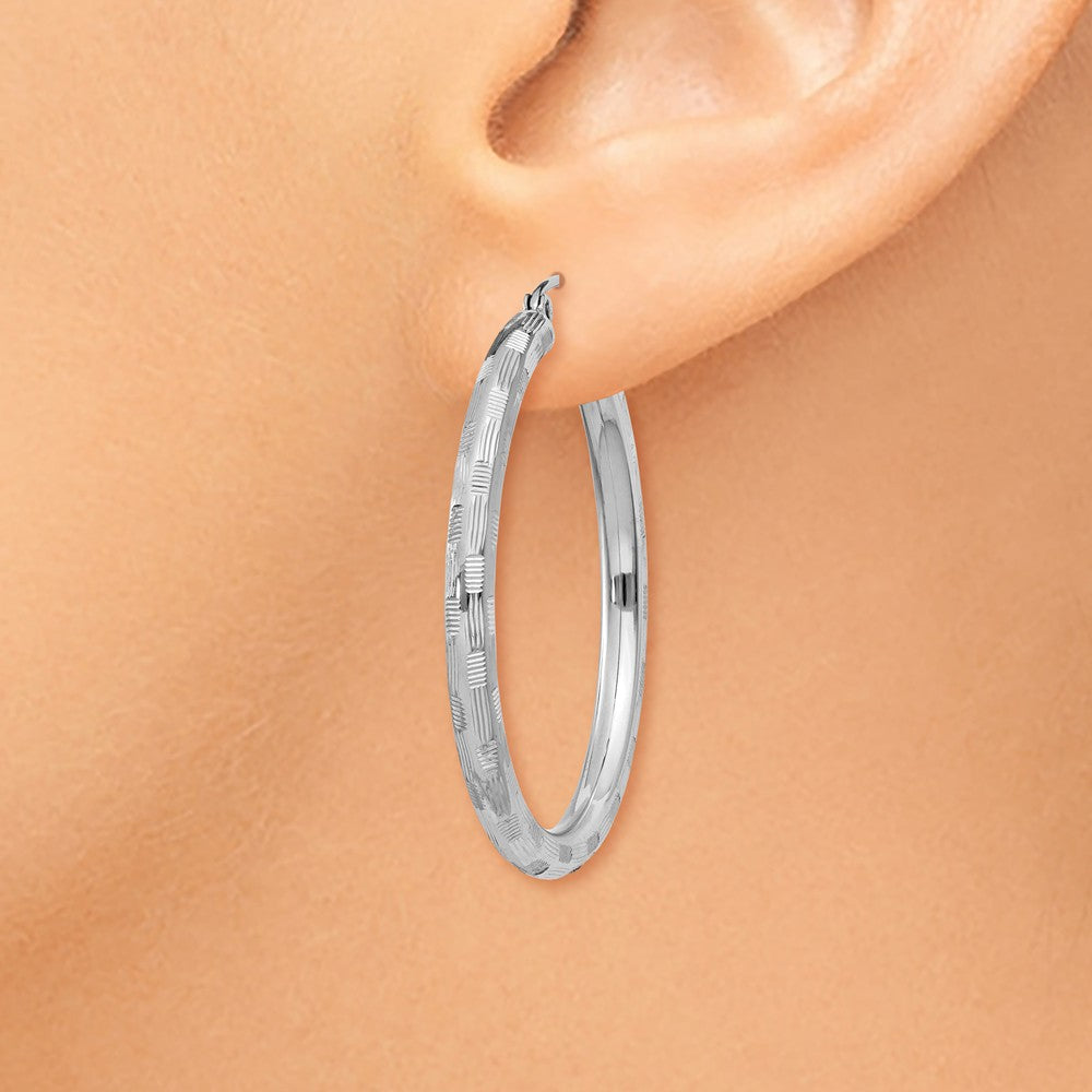 Alternate view of the 3mm x 35mm 14k White Gold Textured Round Hoop Earrings by The Black Bow Jewelry Co.