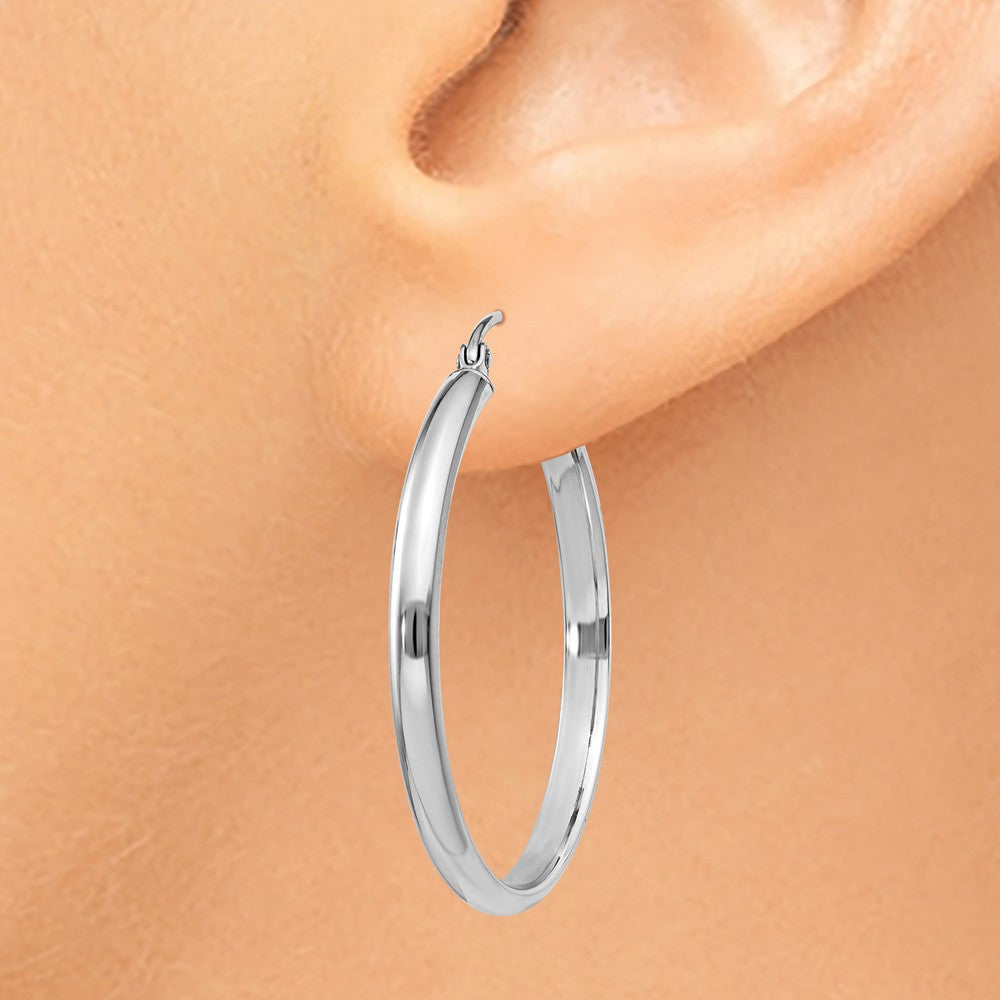 Alternate view of the 2.75mm x 30mm Polished 14k White Gold Domed Round Hoop Earrings by The Black Bow Jewelry Co.