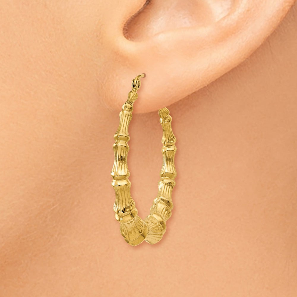 Alternate view of the 6mm x 35mm 14k Yellow Gold Hollow Bamboo Inspired Hoop Earrings by The Black Bow Jewelry Co.