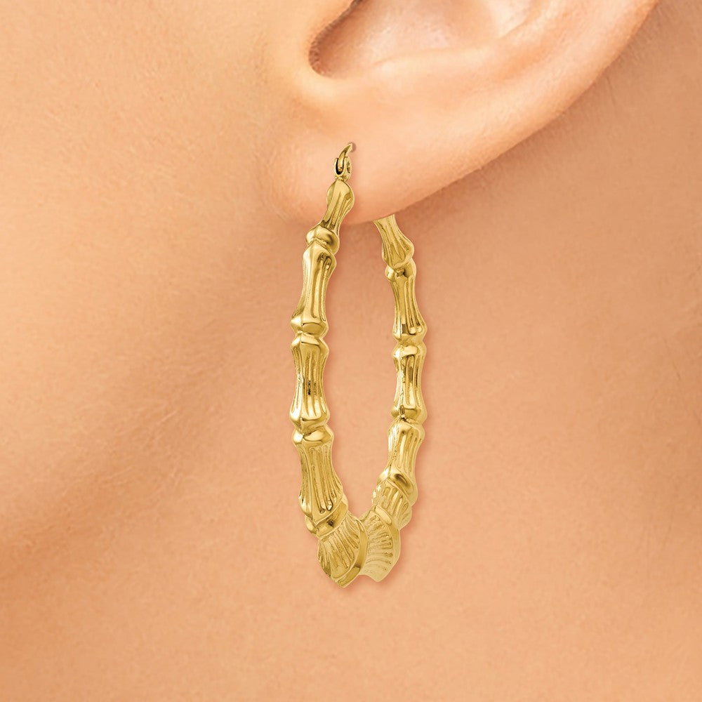 Alternate view of the 8mm x 42mm 14k Yellow Gold Hollow Bamboo Inspired Hoop Earrings by The Black Bow Jewelry Co.