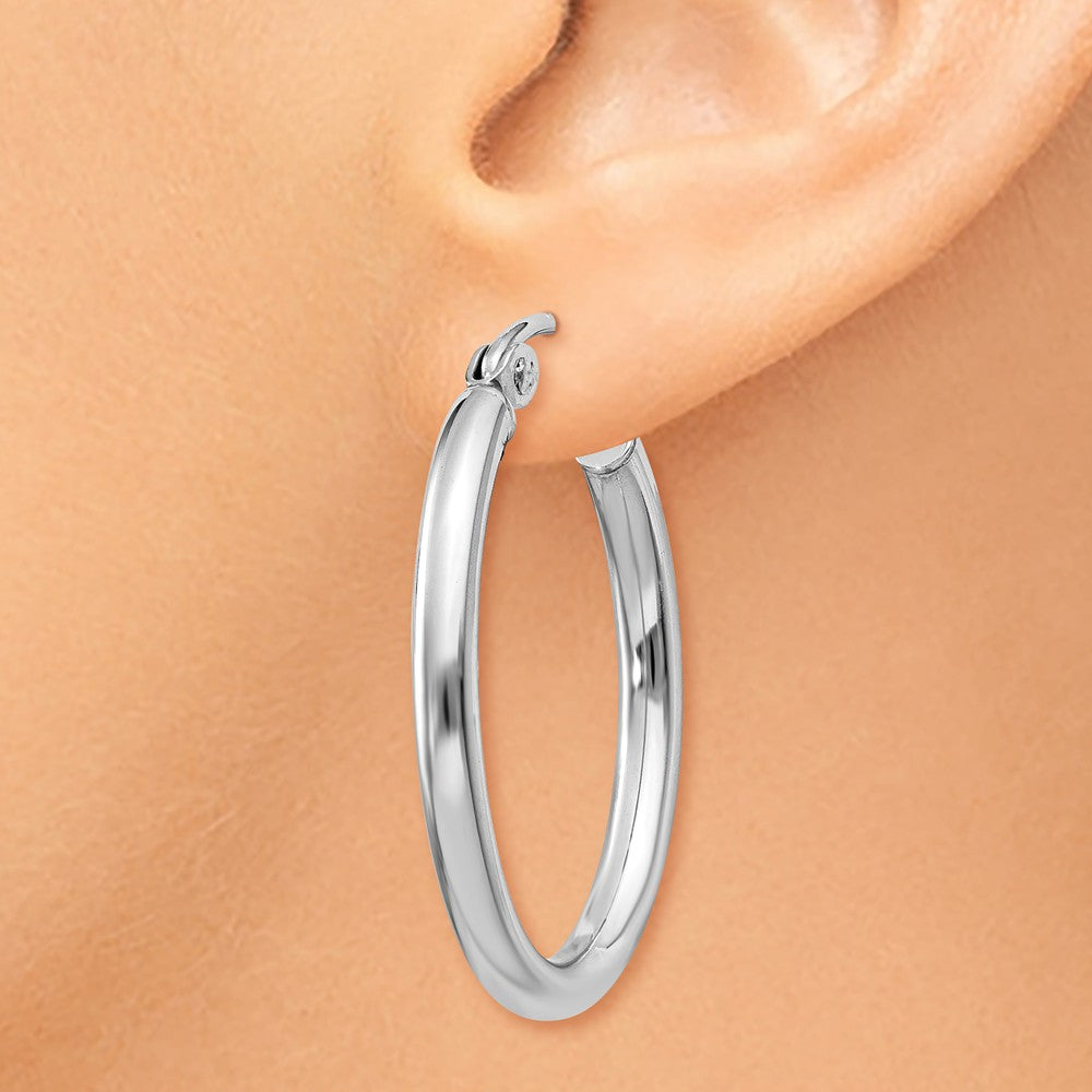 Alternate view of the 2mm x 20mm Polished 14k White Gold Classic Oval Tube Hoop Earrings by The Black Bow Jewelry Co.