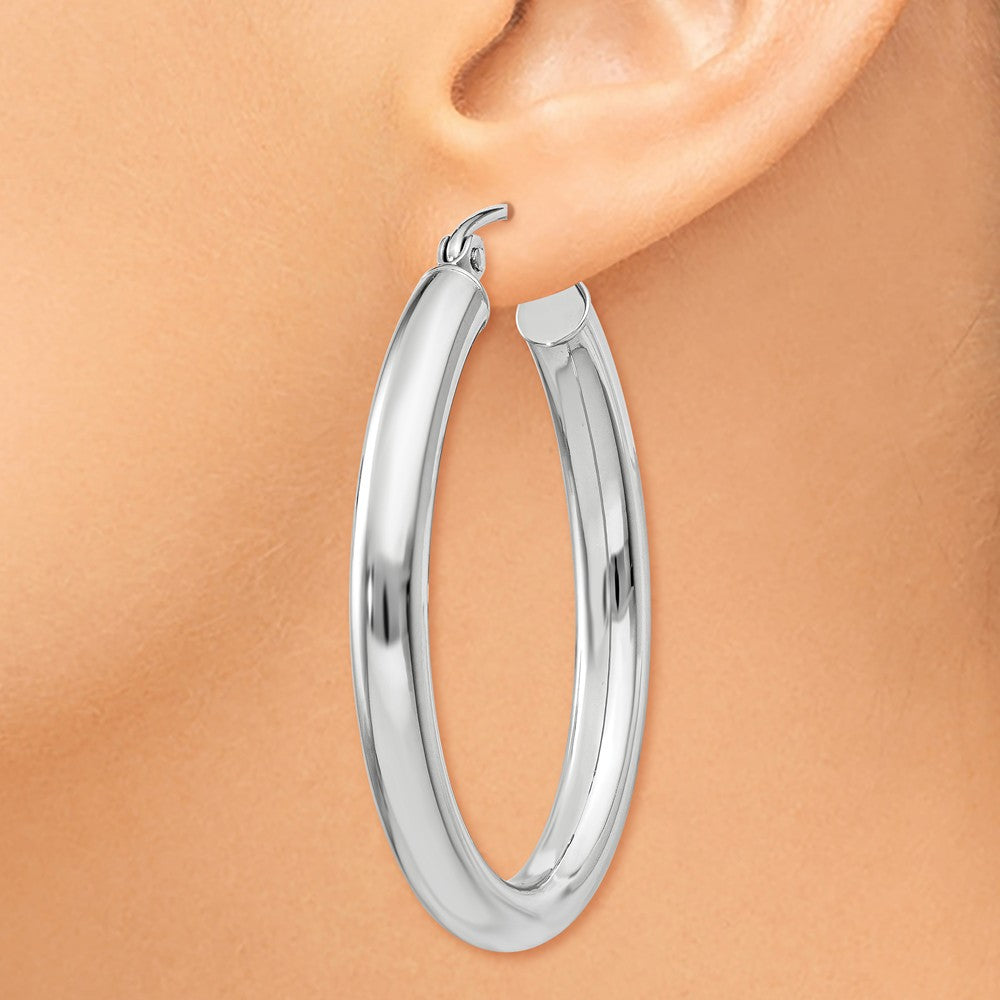 Alternate view of the 3.5mm x 32mm Polished 14k White Gold Classic Oval Tube Hoop Earrings by The Black Bow Jewelry Co.