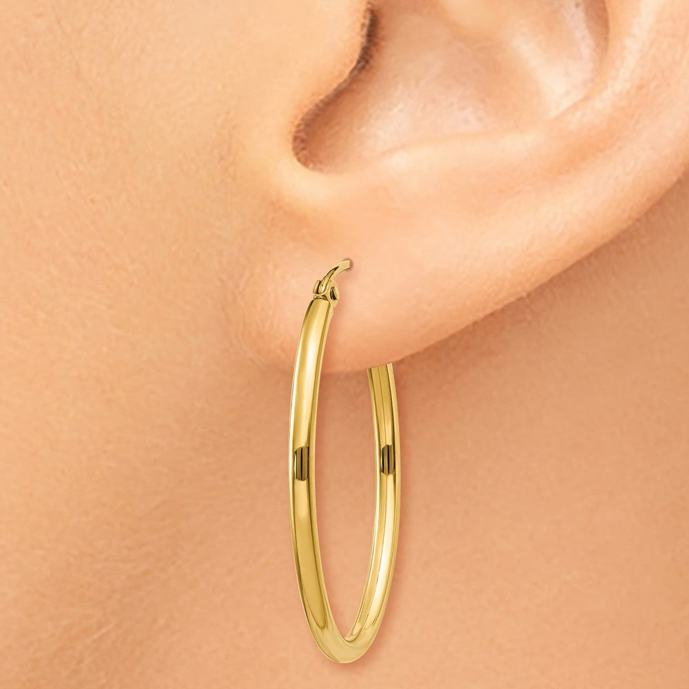 Alternate view of the 2mm x 31mm Polished 14k Yellow Gold Classic Oval Hoop Earrings by The Black Bow Jewelry Co.