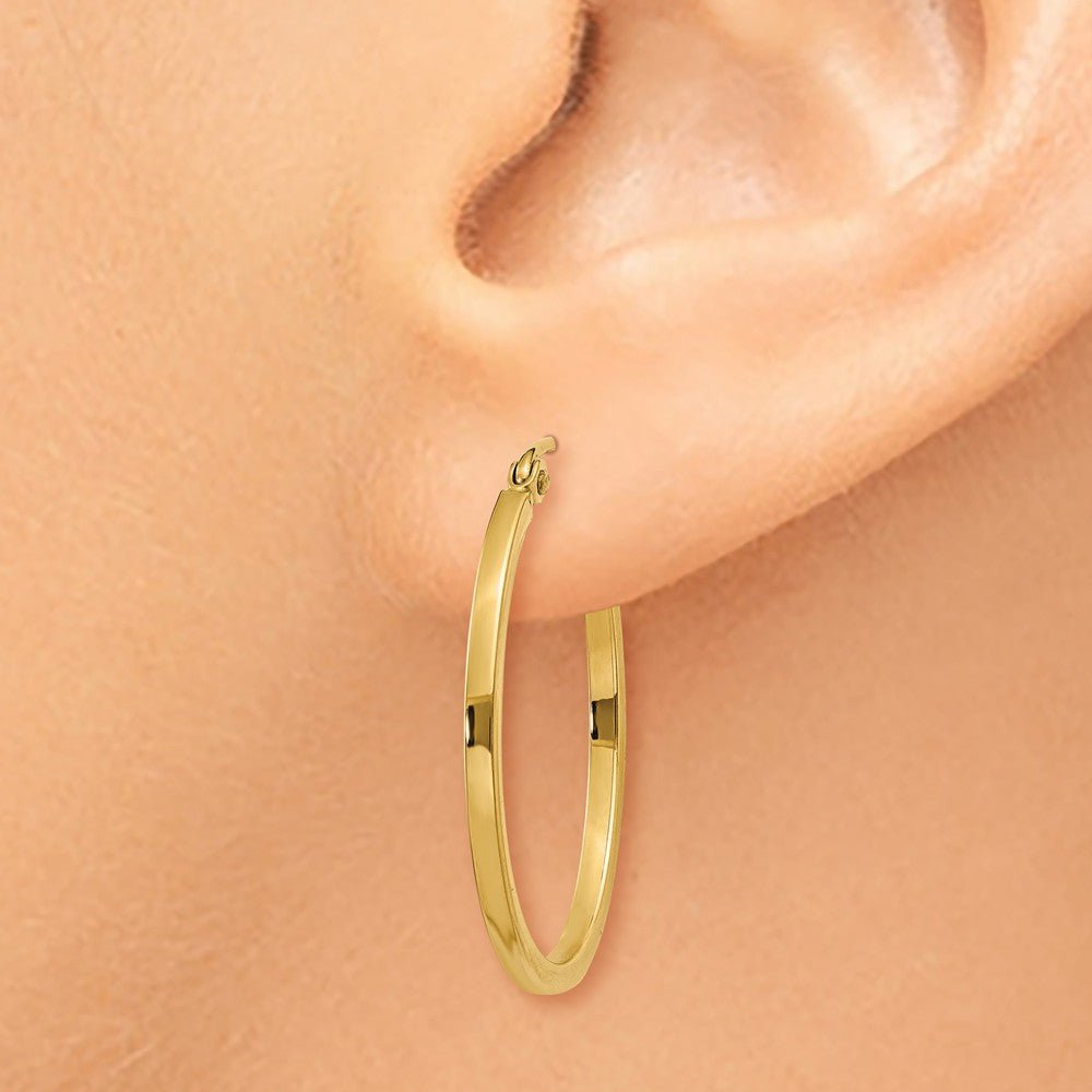 Alternate view of the 1.5mm x 26mm Polished 14k Yellow Gold Square Tube Oval Hoop Earrings by The Black Bow Jewelry Co.