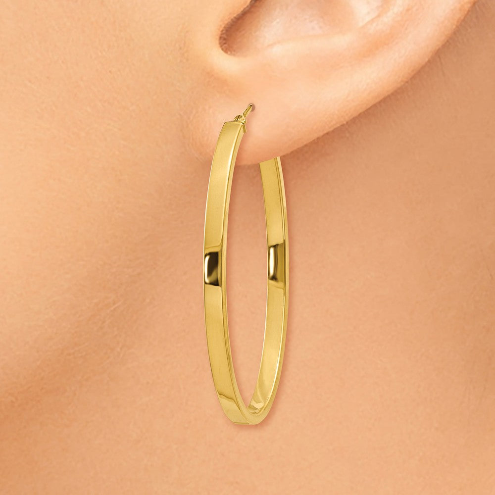 Alternate view of the 3mm x 43mm 14k Yellow Gold Polished Flat Tube Large Oval Hoop Earrings by The Black Bow Jewelry Co.