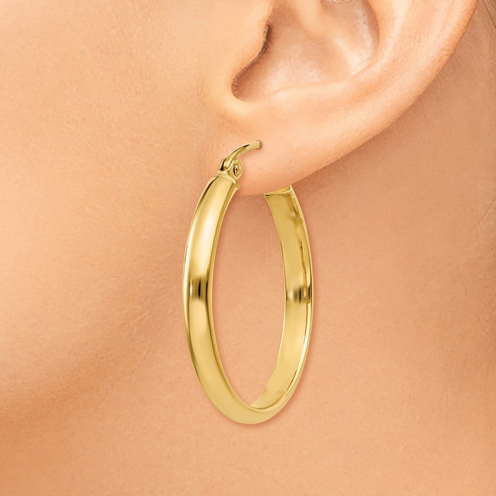 Alternate view of the 2.75mm x 22mm Polished 14k Yellow Gold Domed Round Tube Hoop Earrings by The Black Bow Jewelry Co.