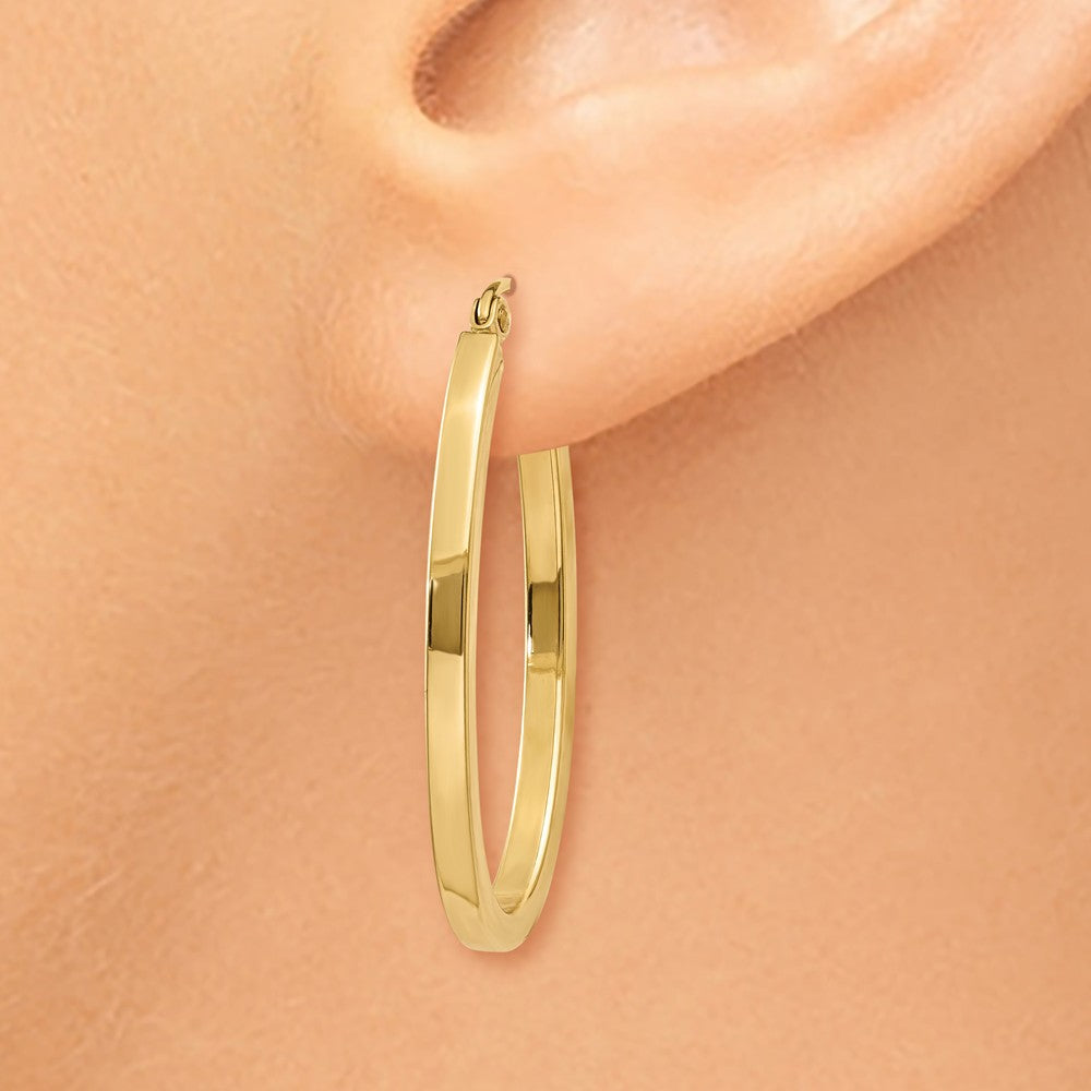 Alternate view of the 2mm x 29mm 14k Yellow Gold Square Tube Oval Hoop Earrings by The Black Bow Jewelry Co.