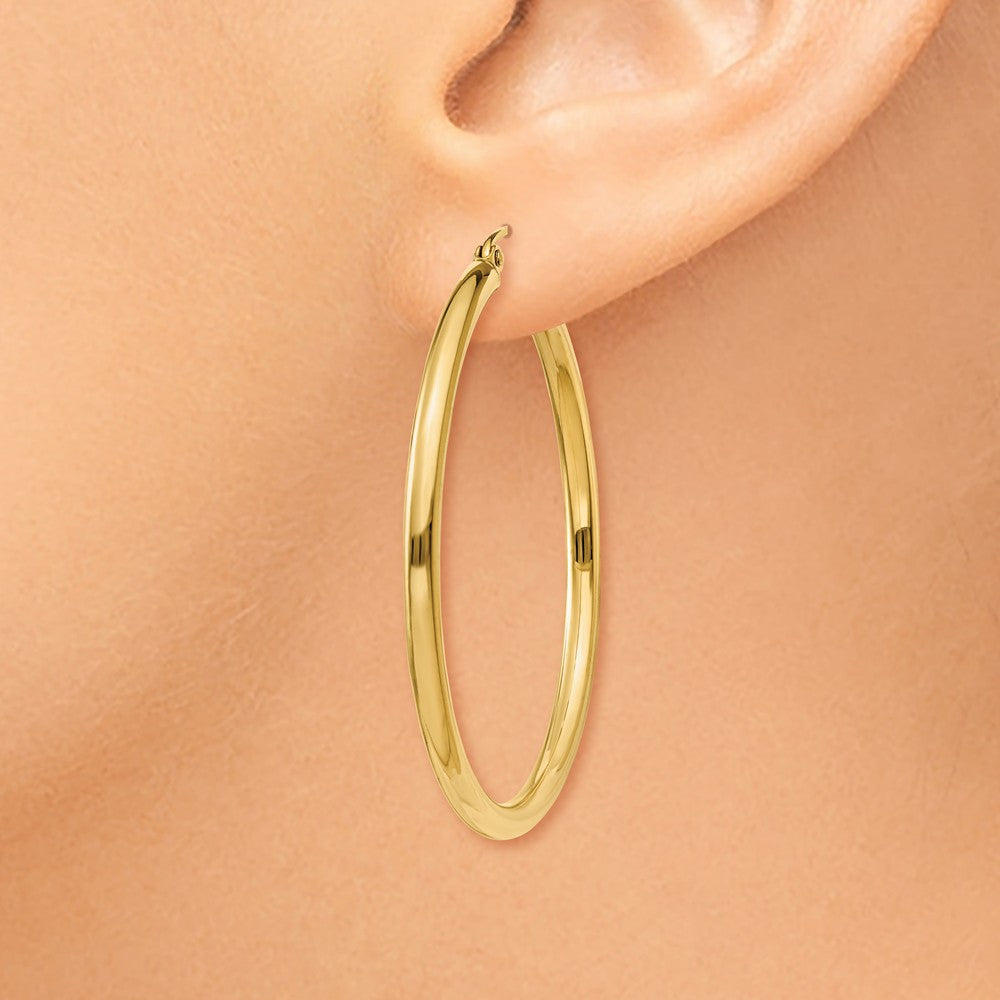 Alternate view of the 2.5mm, 14k Yellow Gold Classic Round Hoop Earrings, 40mm (1 1/2 Inch) by The Black Bow Jewelry Co.