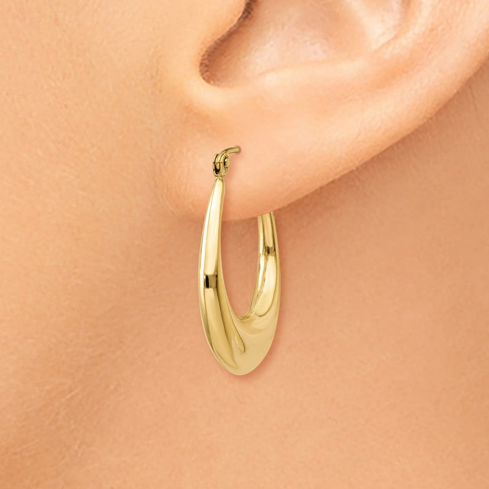 Alternate view of the Tapered Puffed Oval Hoop Earrings in 14k Yellow Gold by The Black Bow Jewelry Co.