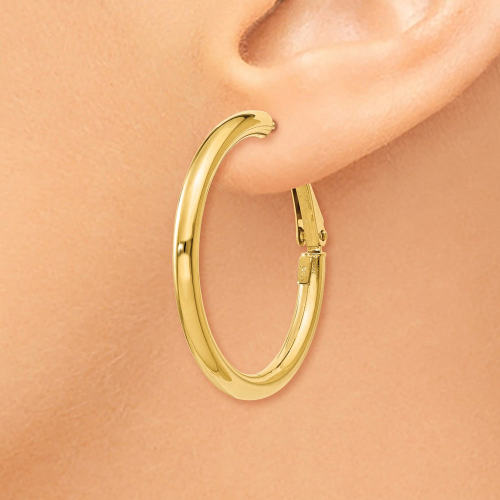 Alternate view of the 3mm, 14k Yellow Gold Omega Back Round Hoop Earrings, 30mm (1 1/8 Inch) by The Black Bow Jewelry Co.